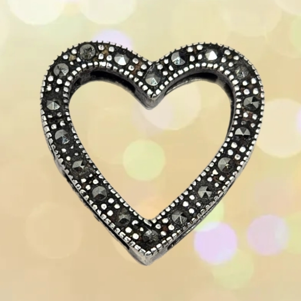 This Sterling .925 Silver Heart Shape Marcasite Stone Slide Open Sides Pendant